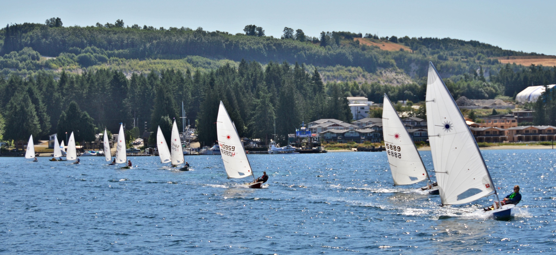 Sailors lead out from the Marina for the start of the 6th Annual Poise Cove Regatta July 16th, 2017