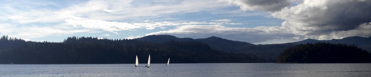 Three boats head back home after late September sailing on Porpoise Bay.